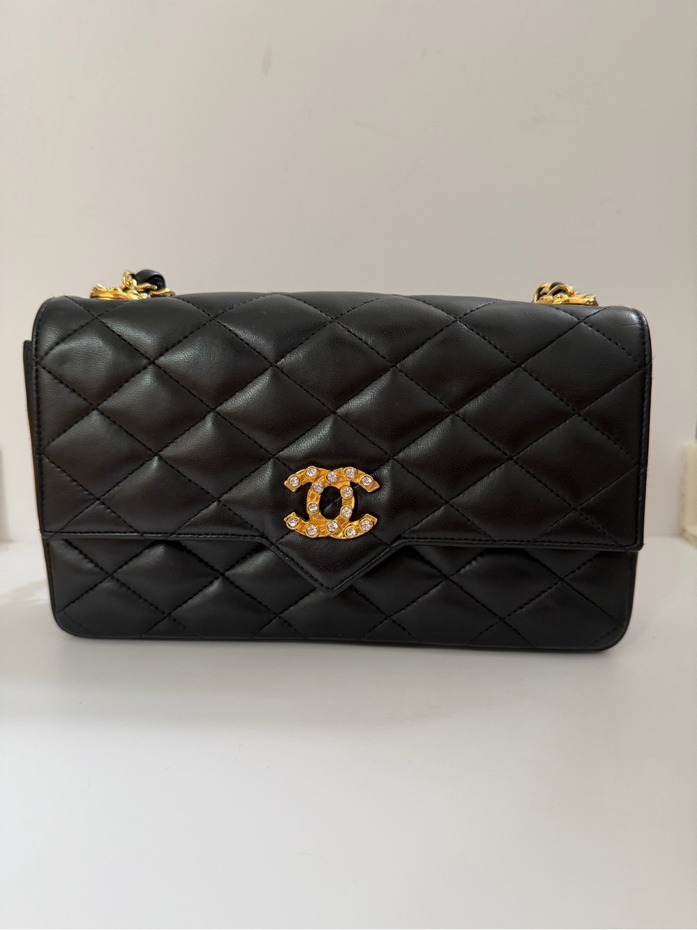 CHANEL Black Quilted Shoulder Bag with Gold Crystal CC